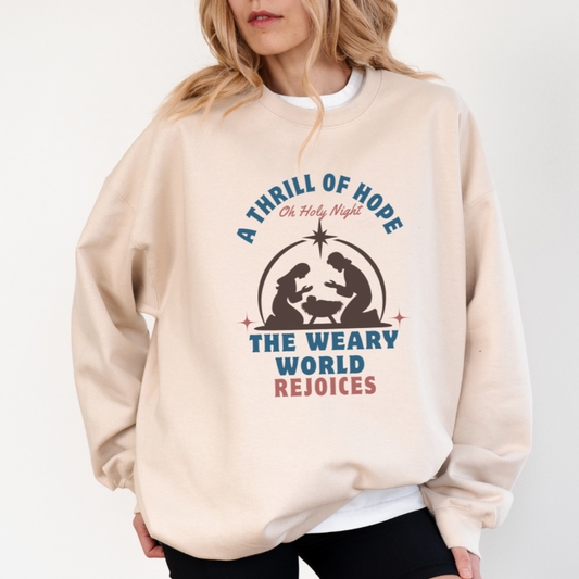 Woman wearing ivory Thrill of Hope Christmas sweater with nativity scene design and Oh Holy Night text