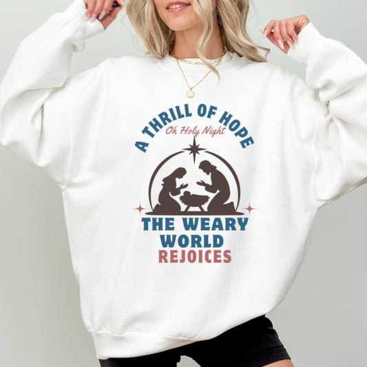 Woman wearing white Thrill of Hope Christmas sweater with nativity scene design and Oh Holy Night text